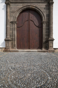 Portal with floor mosaic made of natural stones at the church Iglesia Nuestra Senora de Los Remedios, Buenavista del Norte, Tenerife, Canary Islands, Spain Portal with floor mosaic made of natural stones at the church Iglesia Nuestra Senora de Los Remedios, Buenavista del Norte, Tenerife, Canary Islands, Spain